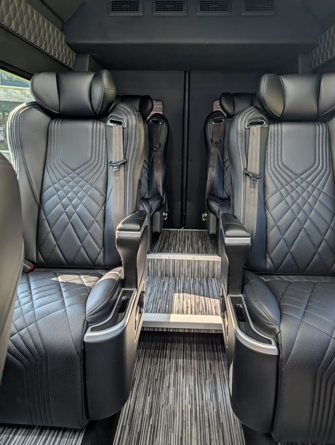Twin rows of captain's chairs inside the Sprinter